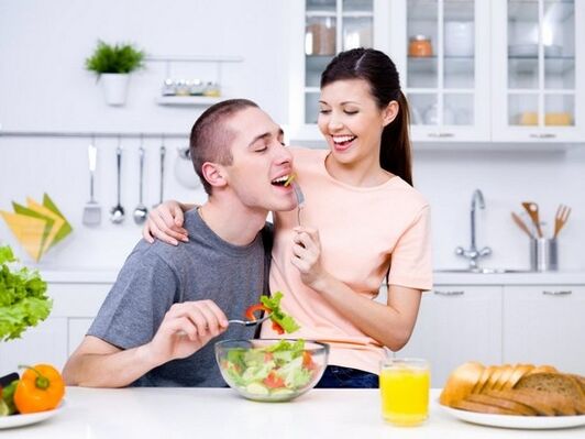 a woman feeds a man with products to naturally increase her potency